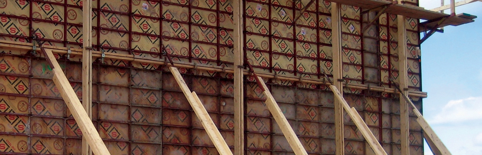 An image from a construction site showing concrete formwork in-place, held up and supported by wooden bracing.