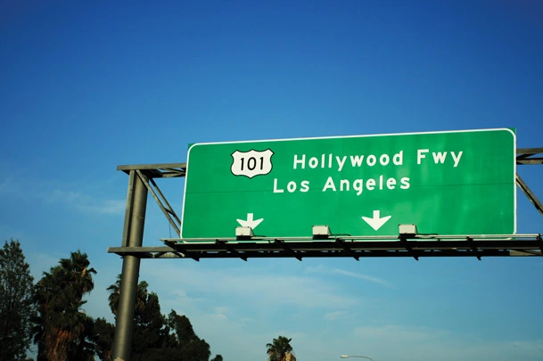Close up shot of a green highway sign for 101 toward Hollywood Freeway/Los Angeles.